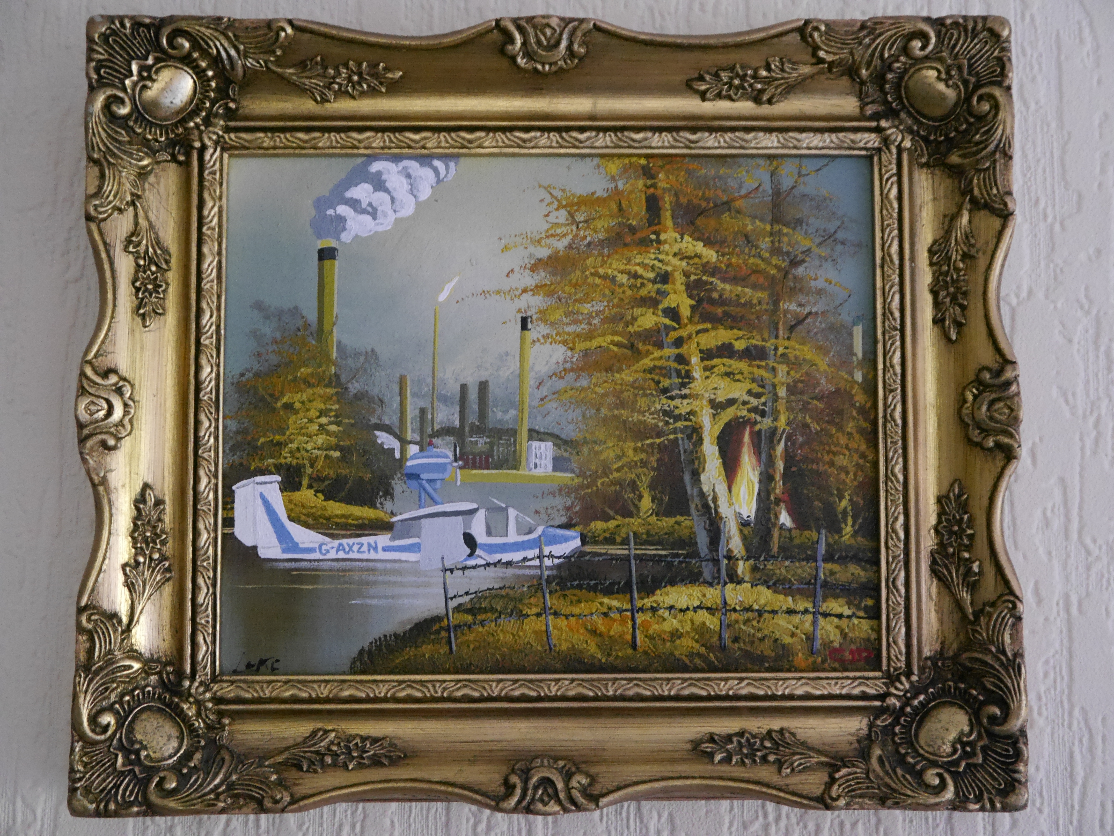contemporary fine art upcycled painting of Canvey Island's refinery skyline, Edward Woodward's seaplane from The Wicker Man, a blaxing fire and a barbed wire fence on recycled charity shop painting in the style of Bob Ross by saatchiart artist Christian Dodd